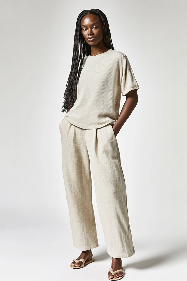 Model wearing The Rib Tee in a natural rib knit with a relaxed fit and soft texture.